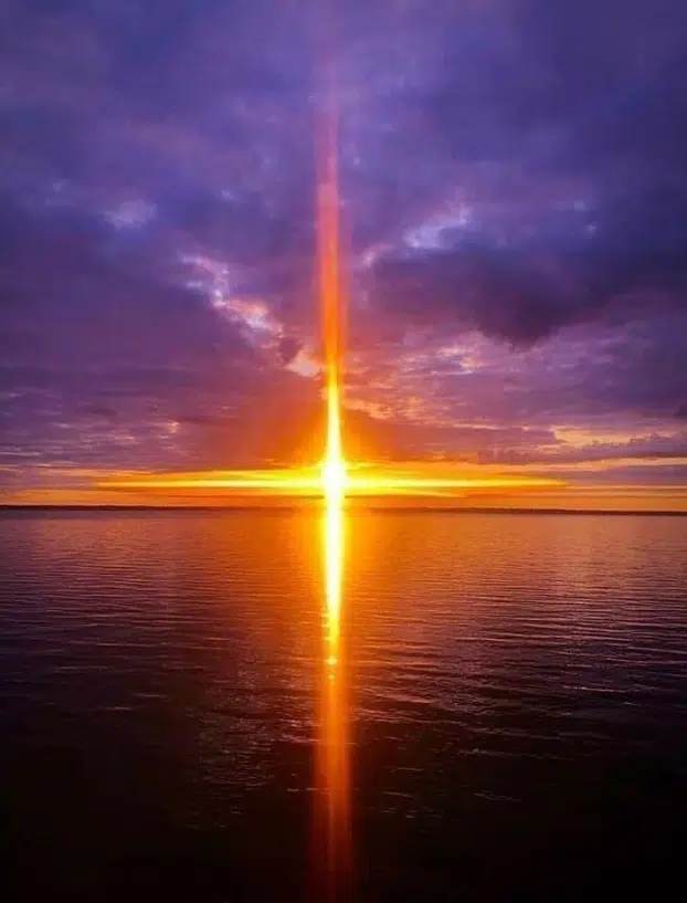 Image of bright sunrise over the ocean